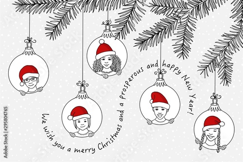 Hand drawn children's faces with santa hats peeking through circles, that hang from a fir branch as Christmas decoration