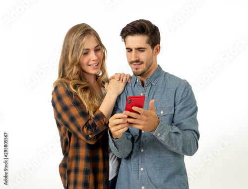 Young couple reading online travel guide book or blog searching for main landmarks photo