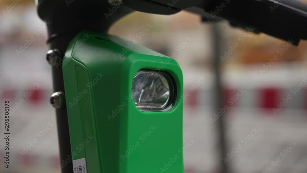 View of the fixed light on an electric scooter in Dortmund, Germany View of the fixed light on an electric scooter in Dortmund, Germany