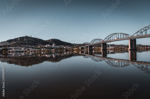 Hometown. What a beautiful view by the bridge and the river. Nice colors too! Amazing sunny day!