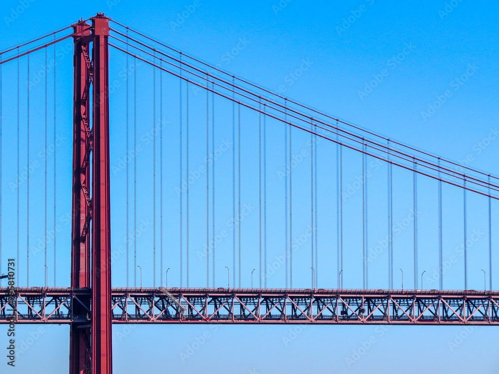 Obraz premium 25th April Bridge in Lisbon, Portugal. Famous landmark on river Tagus.