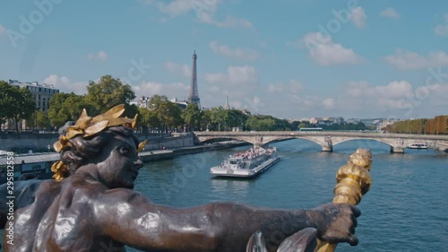 4K Seine river from Pont Alexandre III in Paris, the Eiffel tower in the background and a boat crossing the river during daytime - Slow Motion