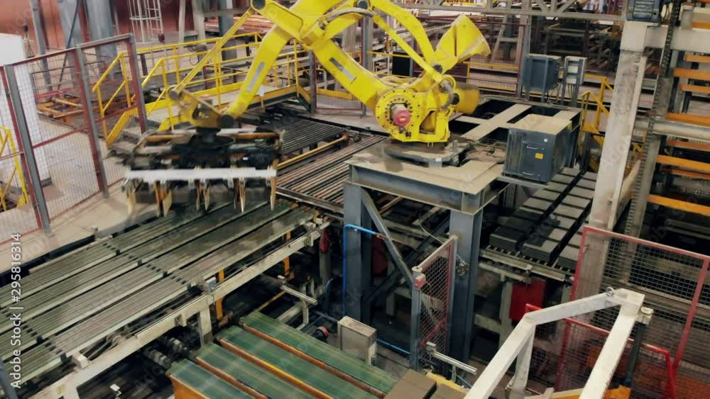 Modern automated mechanical arm is moving at the factory unit. Industrial revolution 4.0 Modern automated mechanical arm is moving at the factory unit. Industrial revolution 4.0