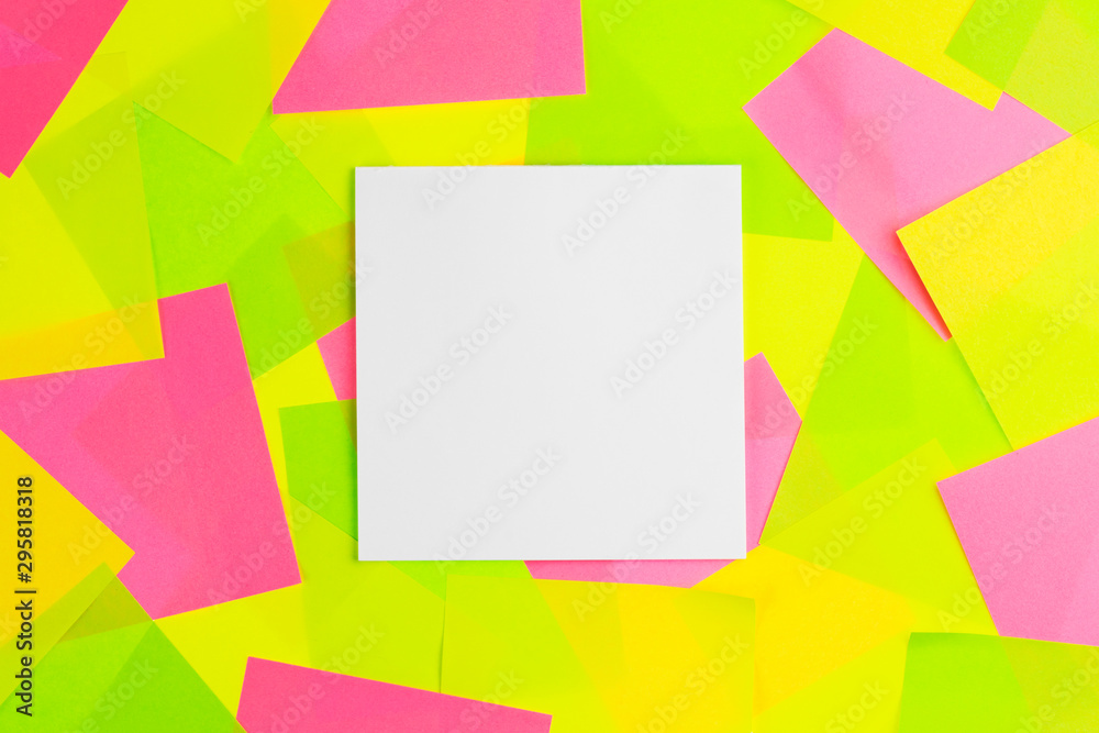 The white paper note put on colorful sticky note background. The white paper note put on colorful sticky note background.