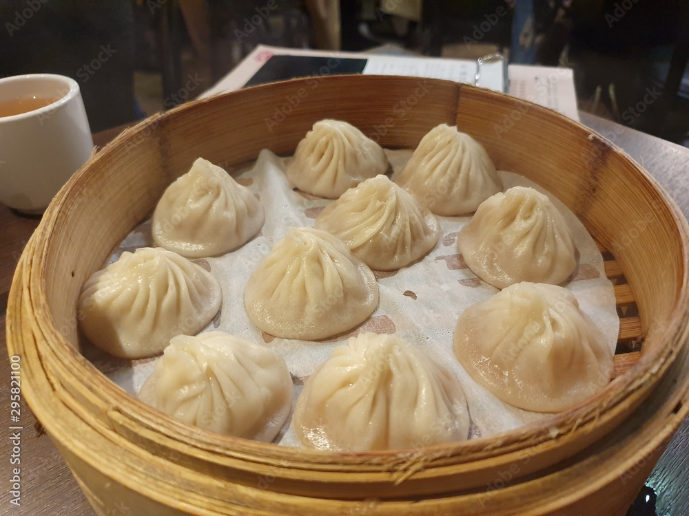 dumplings or dim sum on a table, Taiwanese or Chinese food. dumplings or dim sum on a table, Taiwanese or Chinese food.