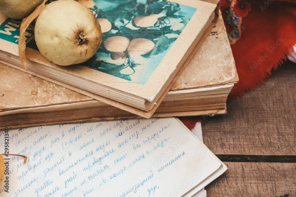 green pears and old book on a light background