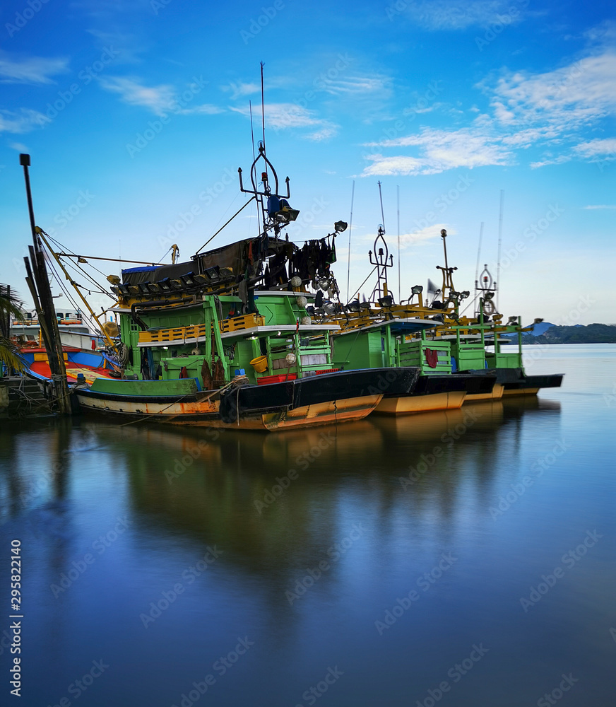 Slow shutter speed of wooden fishing trawlers in Kuala Terengganu, Malaysia.
