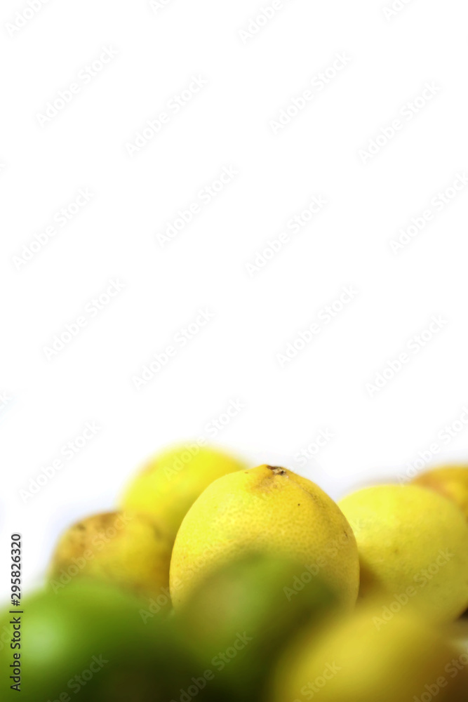 fresh and green lemon with tainted lemon on a white background fresh and green lemon with tainted lemon on a white background