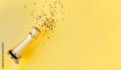 Champagne party concept on a yellow background