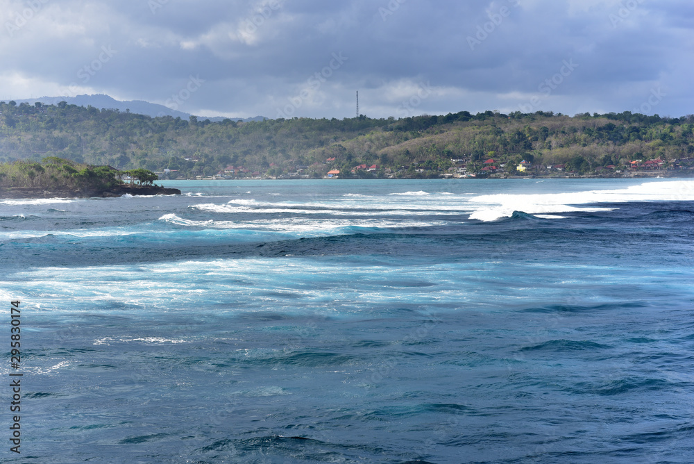 View of the waves from Sunset Point beach at Sandy Bay, Nusa Lembongan, Indonesia View of the waves from Sunset Point beach at Sandy Bay, Nusa Lembongan, Indonesia