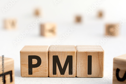 PMI - acronym from wooden blocks with letters, abbreviation PMI Private Mortgage Insurance, Purchasing Managers Index concept, random letters around, white  background photo