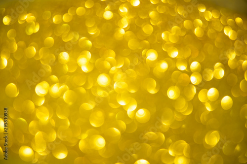 golden blur abstract background. yellow bokeh christmas blurred beautiful shiny Christmas lights