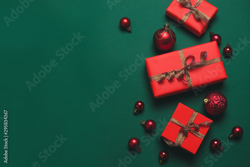 2023 Xmas background design with red gift box with gold ribbon and red balls. Minimal christmas concept idea.