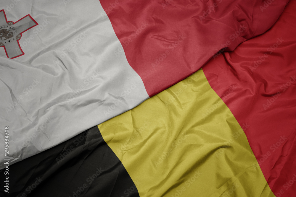 waving colorful flag of belgium and national flag of malta. waving colorful flag of belgium and national flag of malta.