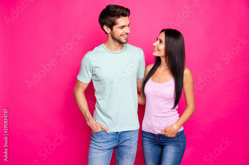 Photo of amazing couple guy and lady in love standing hugging enjoy best company wear casual clothes isolated bright pink color background © deagreez