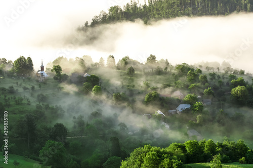 Beautiful scenery landscape sunrise foggy morning village Maramures Romania  © Cristi