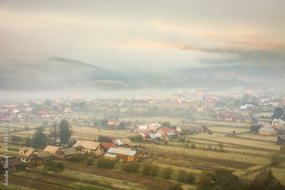 Beautiful landscape mountain hill meadow sunrise foggy morning village Bucovina Romania Beautiful landscape mountain hill meadow sunrise foggy morning village Bucovina Romania