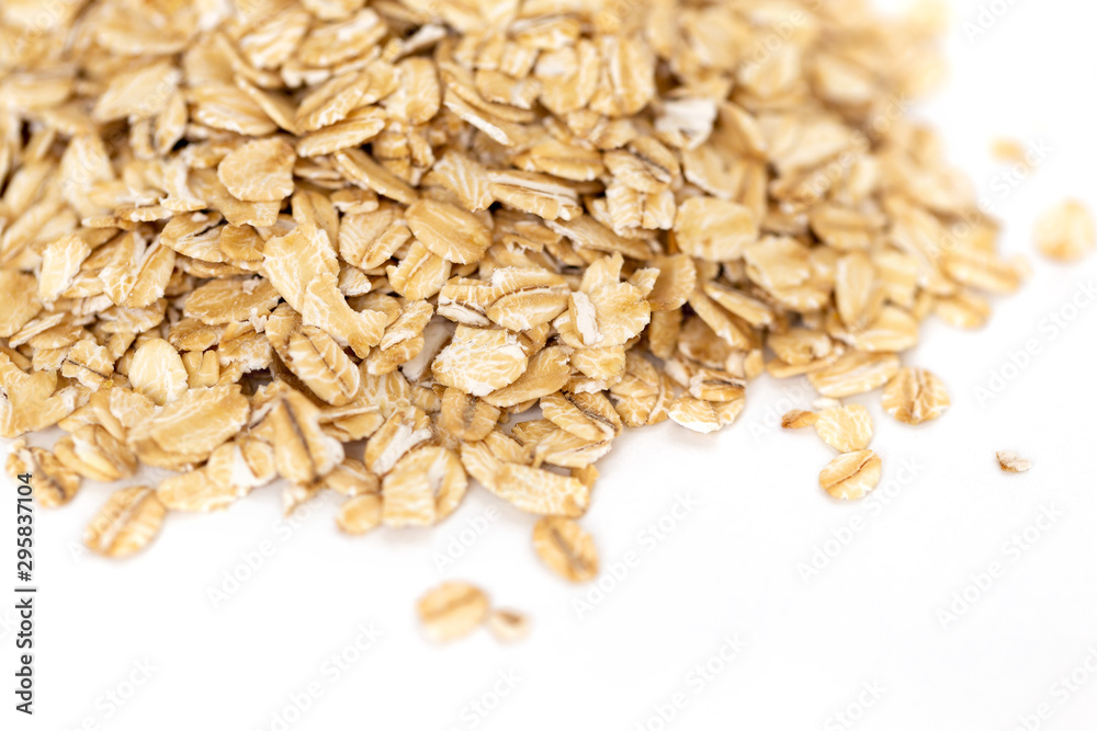 Heap of whole organic oats isolated on white background Heap of whole organic oats isolated on white background