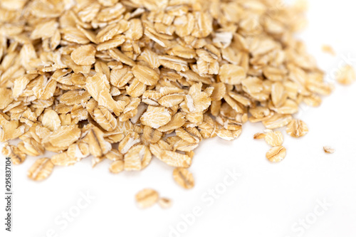 Heap of whole organic oats isolated on white background