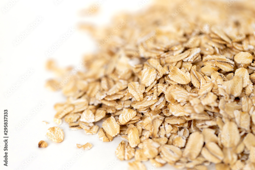 Heap of whole organic oats isolated on white background Heap of whole organic oats isolated on white background