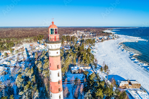 SaintPetersburg. Russia. Osinovetz. View from the height to the osinovetsky lighthouse. Lighthouse on lake Ladoga. The old lighthouse on the coast. Winter landscape of lake Ladoga. Leningrad region. photo