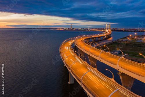 Saint Petersburg. Russia. Obukhov bridge. City Highway at night. Night highway. Highway bridge over the water. Lighting of the Expressway at night. Movement. The roads of the metropolis. Road network photo