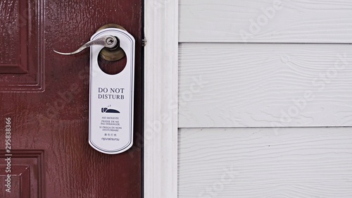 door knob hanging with message note, communication sign message, do not disturb