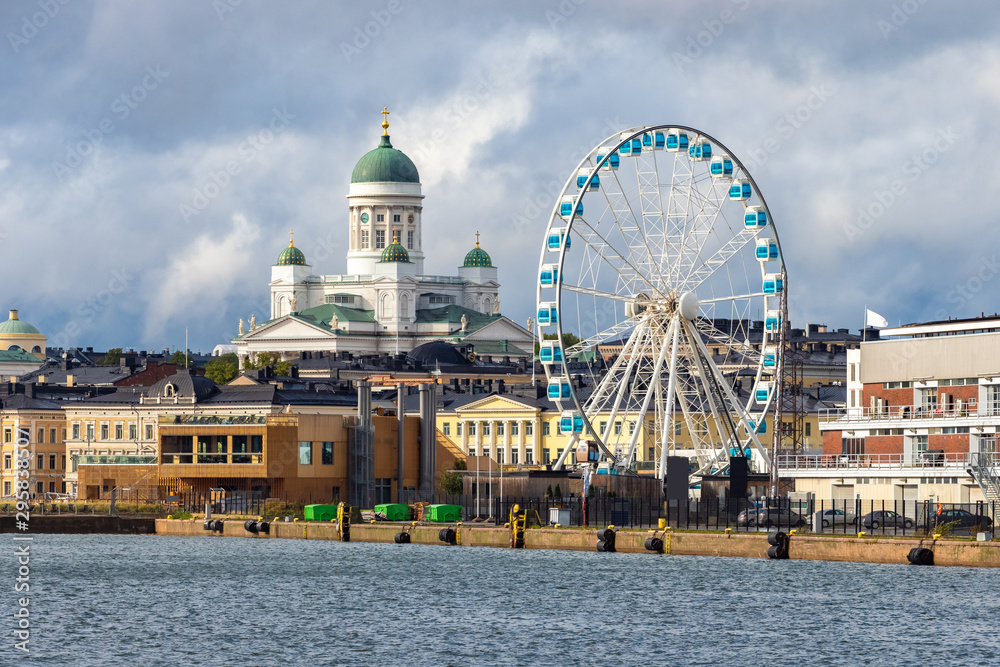Finland. Helsinki. The cruise port. Sightseeing In Helsinki. Ferris wheel in the Harbor on the Baltic sea. Suurkirkko. Cathedral Of St. Nicholas.  Travelling to Scandinavia. SkyWheel.