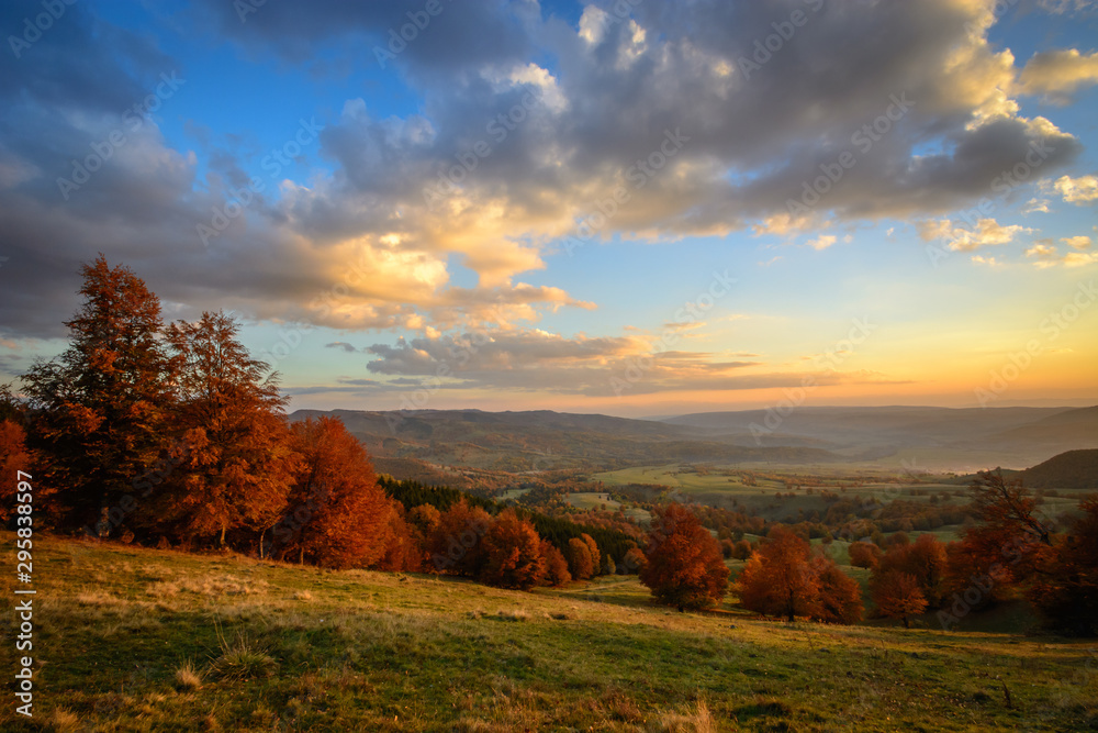 Beautiful landscape mountain hill meadow sunrise morning village Romania 