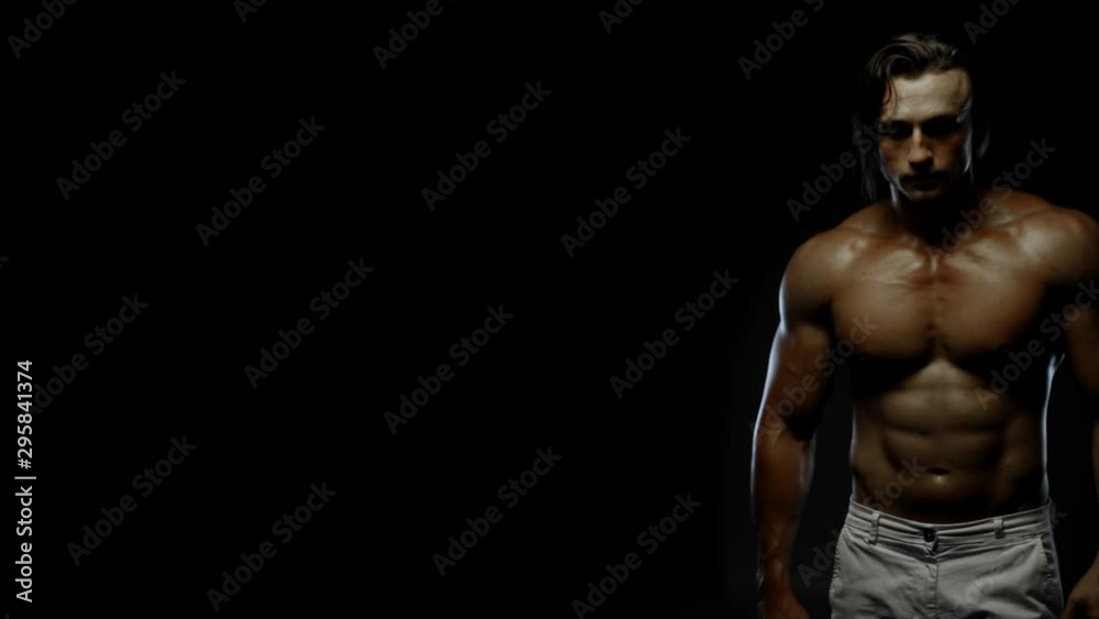 Fitness tanned guy showing muscles, close up, copy space