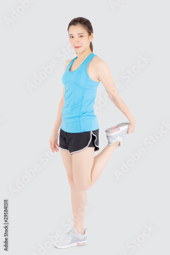 Beautiful young asian woman in sport standing stretch muscle leg exercise with healthy isolated on white background, asia girl shape fit warm up and workout training for healthy, wellness concept. © N_studio