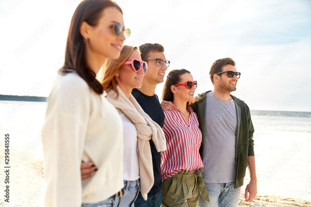 friendship, leisure and people concept - group of happy friends on beach in summer friendship, leisure and people concept - group of happy friends on beach in summer