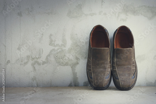 Man shoes over grunge background (Vintage style colors)