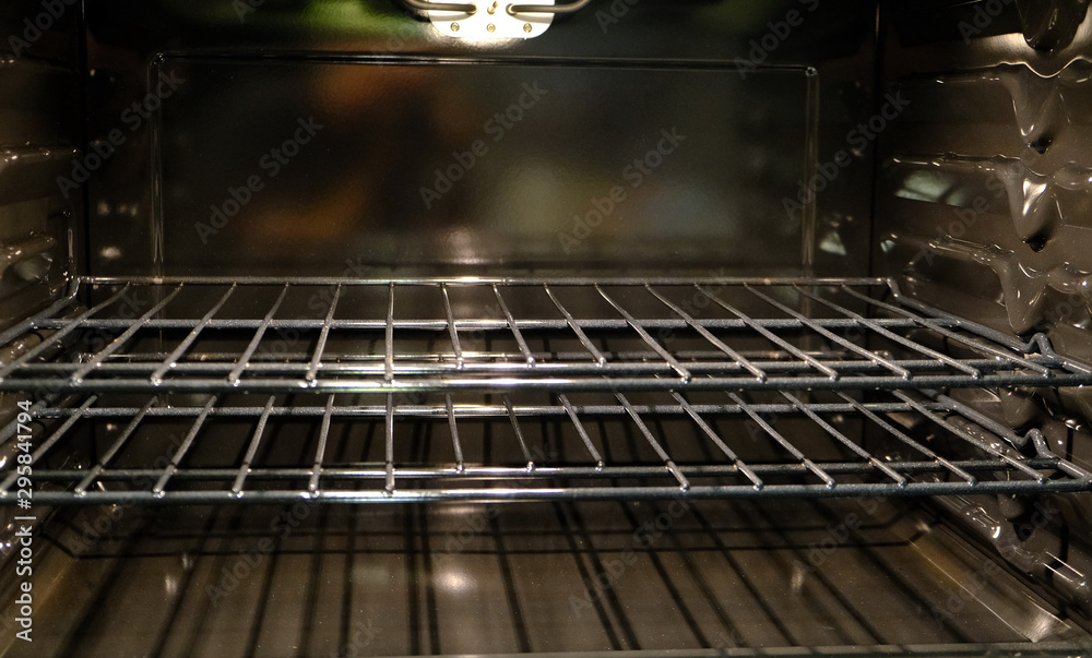 A View Inside a Clean Oven with light on A View Inside a Clean Oven with light on