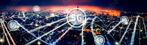 aerial view city at night and 5g network tech concepts