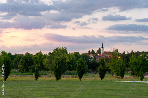 sunset over a village and church in Central Europe Austria © Bernadett