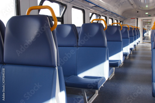 free passenger seats in an empty car of the city train © Анатолий Казаков