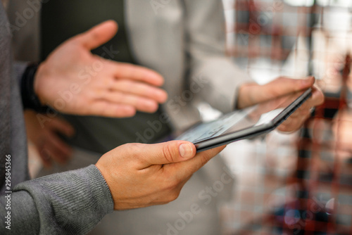 Male hand holding digital tablet