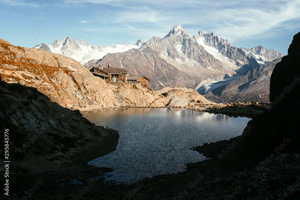 Picturesque view of clear water and mountains reflection on Lac Blanc lake in France Alps. Monte Bianco mountain range on background. Landscape photography, Chamonix.