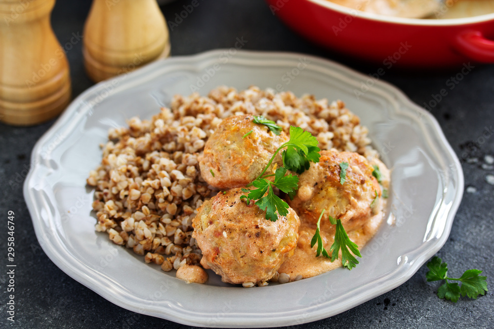 Meatballs in a creamy tomato sauce.