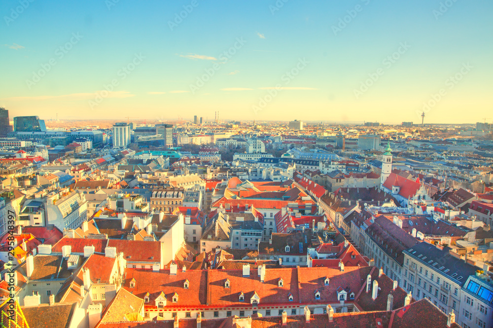 Panoramic view to Stephansplatz and Vienna center, a lot of orange tile roofs. Beautiful bright colors. Vienna, Austria. 