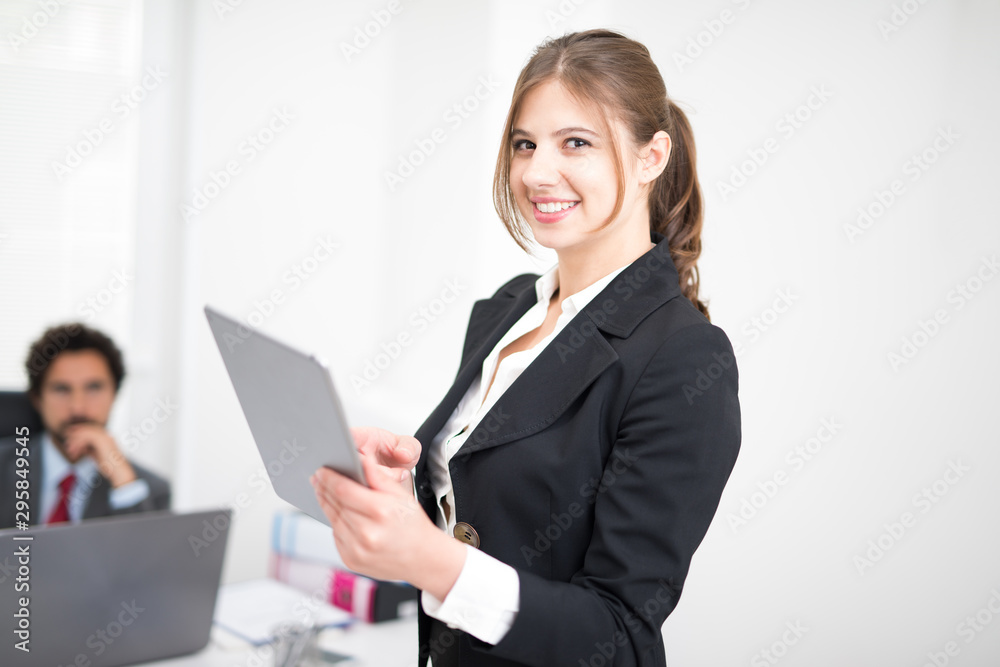 Portrait of a smiling businesswoman using a digital tablet Portrait of a smiling businesswoman using a digital tablet