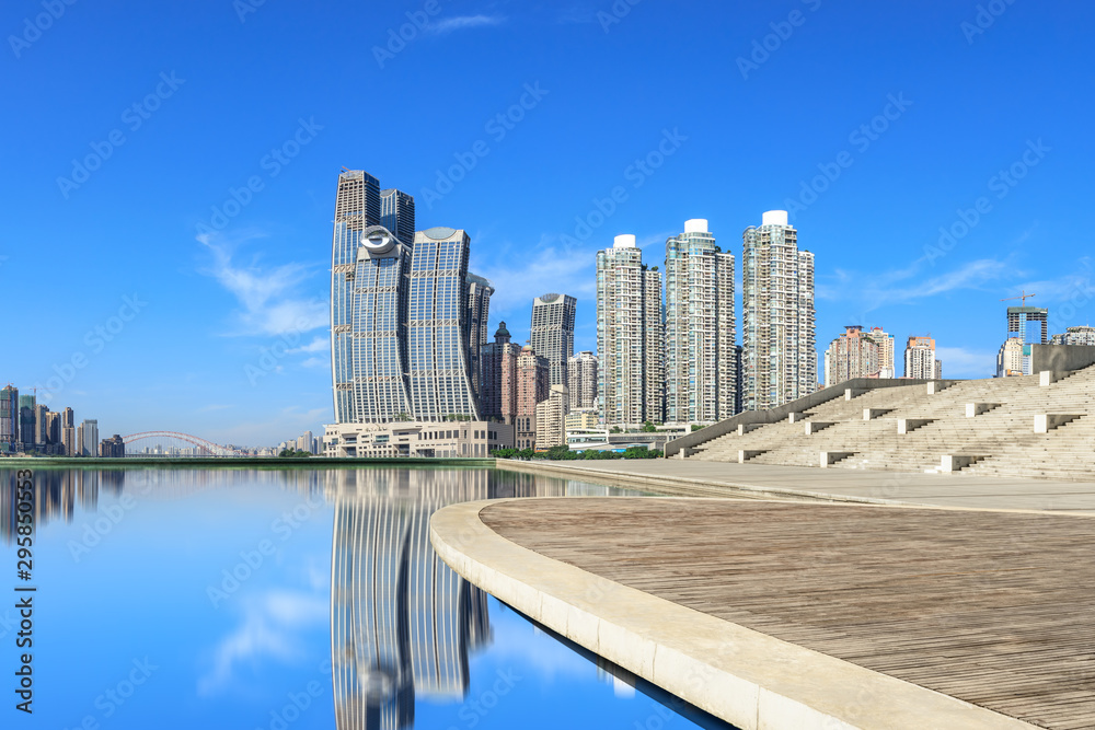 Wooden board square and modern city financial district skyline in Chongqing,China.