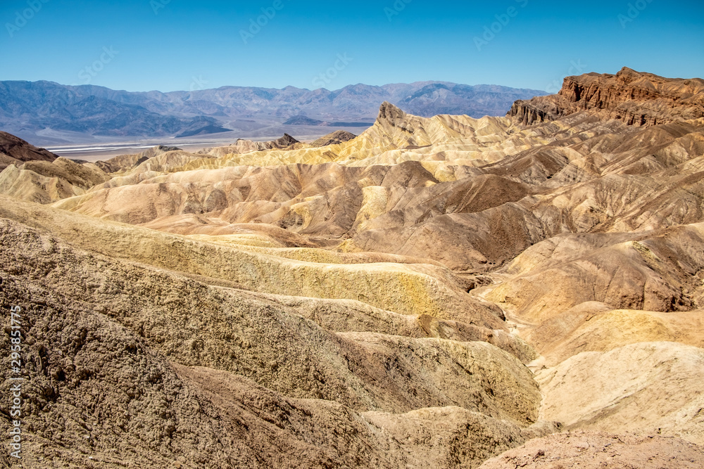 Eroding volcanic ash and silt hills, badlands, at Zabriskie Point, Death Valley National Park, California, USA Eroding volcanic ash and silt hills, badlands, at Zabriskie Point, Death Valley National Park, California, USA
