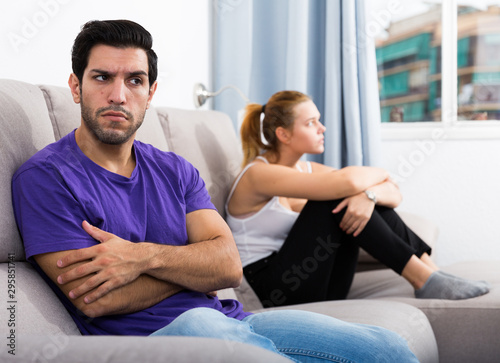 Man on sofa after quarrel with wife