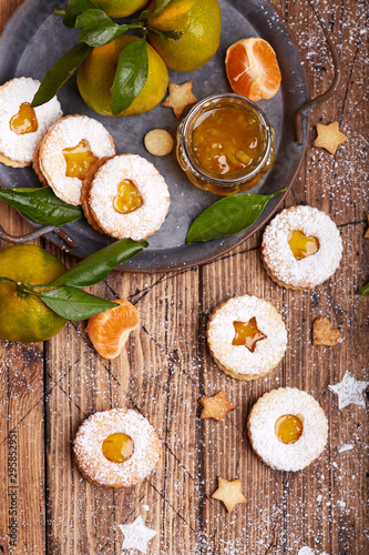 Linzer Christmas cookies with tangerine jam and sugar powder. Delicious biscuits. Sweet dessert