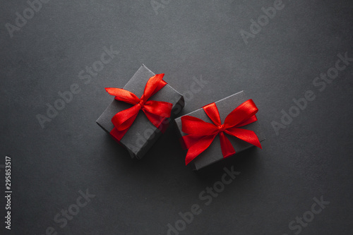 Cute gift boxes on black background