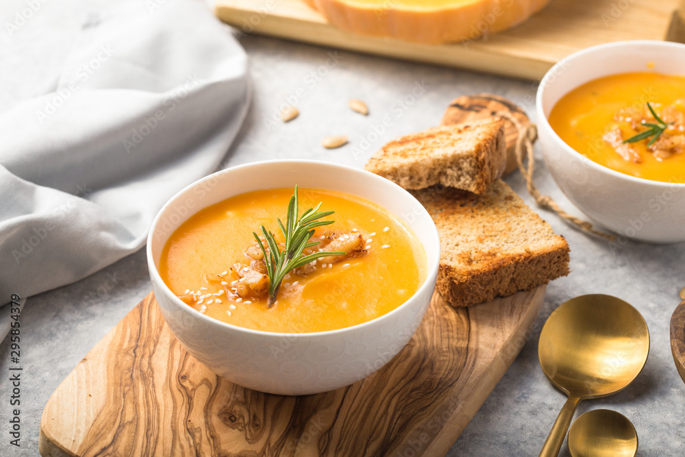 Homemade Autumn Butternut Squash pumpkin cream Soup with Bread and seeds. top view Homemade Autumn Butternut Squash pumpkin cream Soup with Bread and seeds. top view