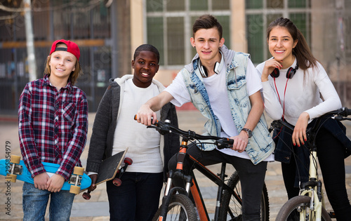 teens chatting near bikes © JackF