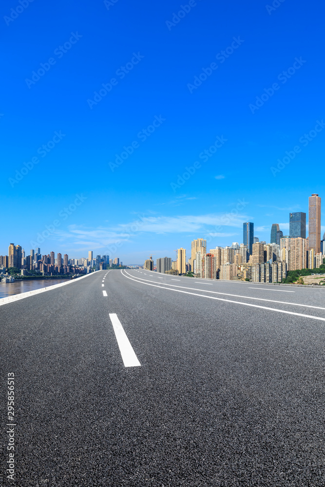 Empty asphalt highway and modern city financial district in chongqing,China.